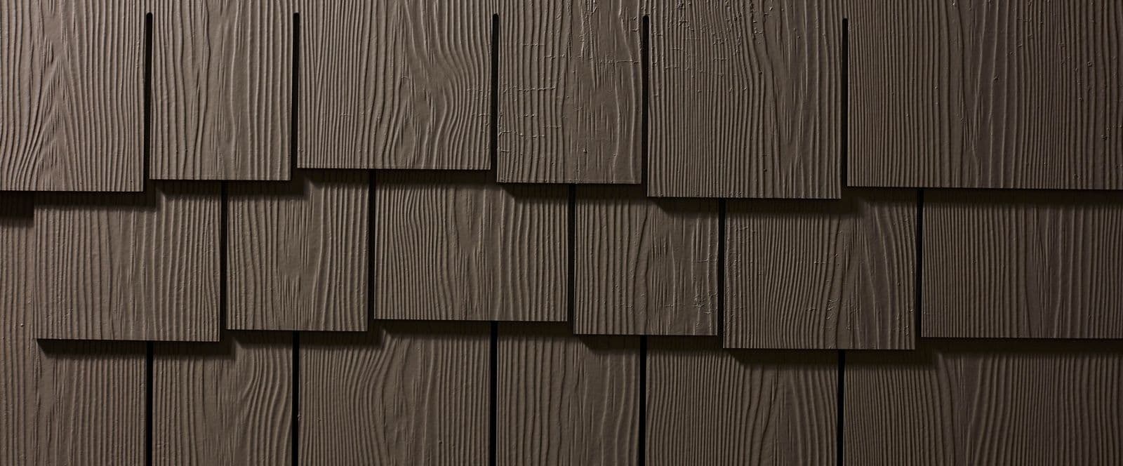 Close-up of Allura Multishake staggered-edge shake siding in Sable Brown.