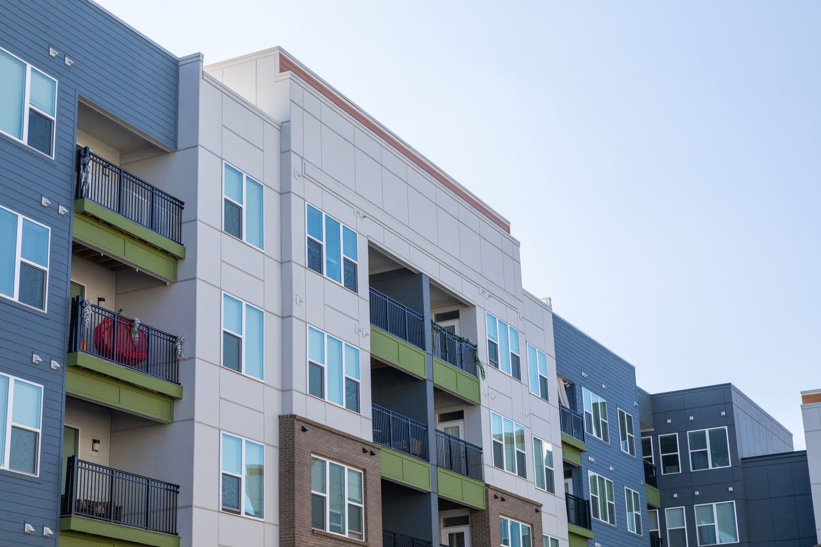 Multi-family building exterior finished with Allura fibre cement panels.
