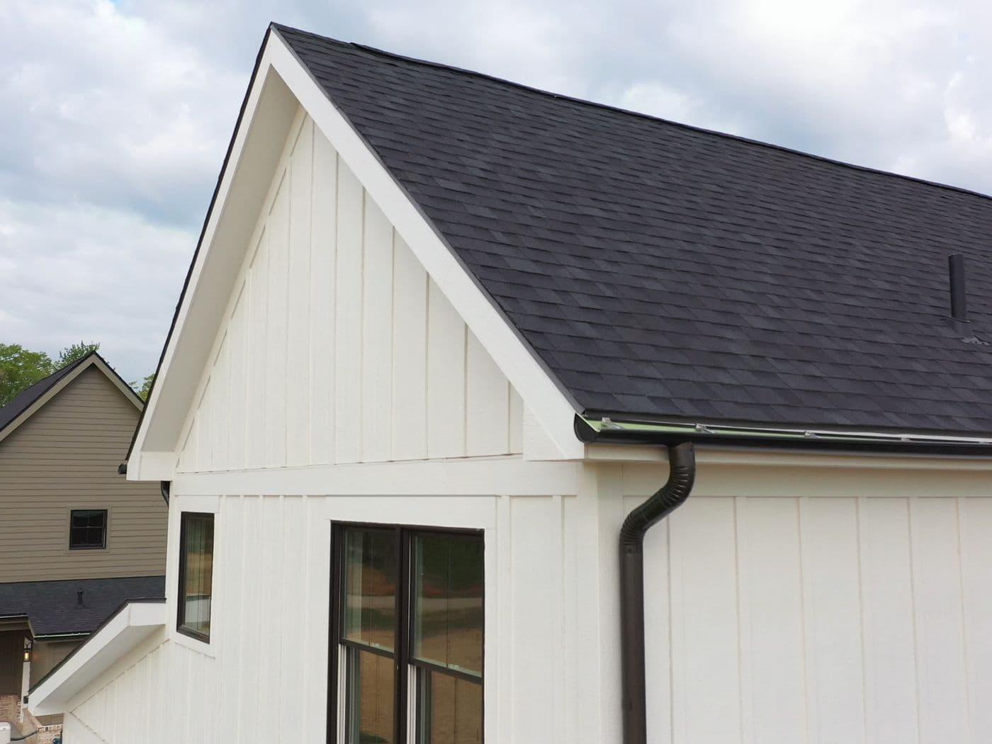 White farmhouse-style gable with LP SmartTrim fascia and rake trim.